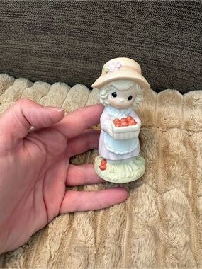Precious Moments: girl Figurine Holding Basket of fruit